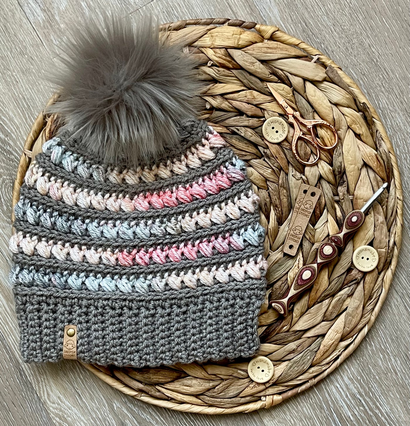 Gray, Pink, Yellow, Blue Multi-Colored Crocheted Beanie with faux fur pom pom