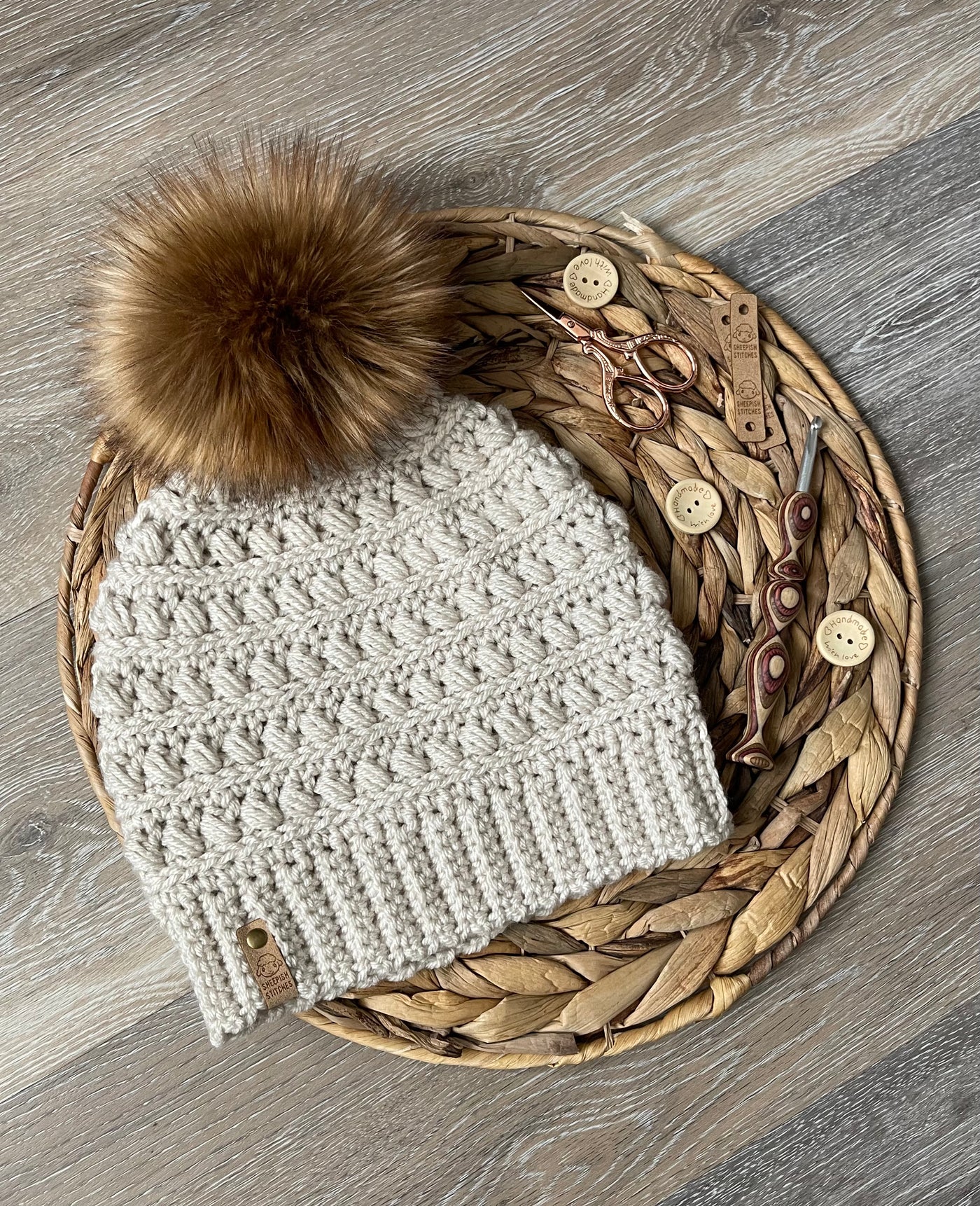 Off White Crocheted Beanie with faux fur pom pom